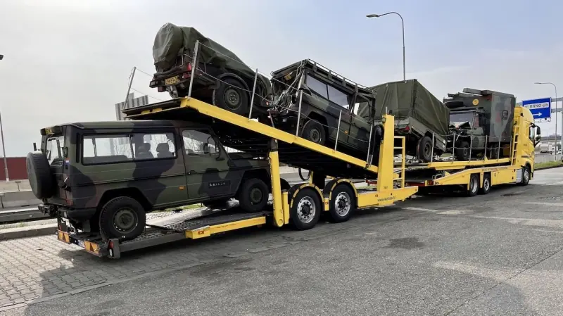 Off-road vehicles loaded on a car transporter