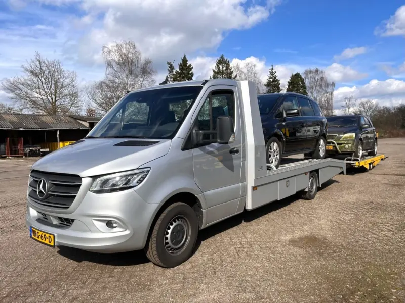 Recovery van with a car trailer